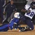  Fayetteville running back Brice Gahagans is tackled by a West Memphis defender Friday during their ...