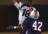 Fayetteville quarterback Brandon Allen passes over West Memphis’ Cordarius Cole during Friday night’s Class 7A playoff game in West Memphis. Allen passed for 412 yards and five touchdowns.


