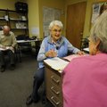 Linda Eichmann, left, discusses a client’s needs with daily manager Margot Martin on Monday at Coope...