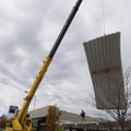  A crew with Multi-Craft Contractors removes part of the metal roof from the Shiloh Square on Wednes...
