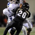 Bryant tight end Ian Shuttleworth is hit by Bentonville linebacker Chris Scroggins after a catch Fri...