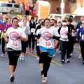 GIRLS ON THE RUN Runners start east on Northeast Second Street Saturday in the Girls on the Run 10K ...