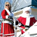 SANTA’S ARRIVAL Santa Claus and Mrs. Claus arrive at Pinnacle Hills Promenade in Rogers on Saturday....