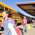 Students catch buses home for the holiday vacation at Central Park Elementary School in Bentonville ...