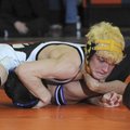 Bentonville’s Robert Lewis tries to pin Fayetteville’s Bryan Arroyos during the 7A-West Conference T...