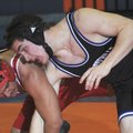 Fayetteville’s Cameron Baker, right, wrestles with Fort Smith Northside’s Victor Chavez on Feb. 13 d...