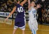 Springdale Har-Ber guard Sierra Dickard shoots a layup Monday while guarded by Elkins’ Morgan Strong in Wildcat Arena in Springdale.