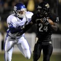 Bentonville running back Demarcus Murphy shakes loose from Bryant linebacker Hunter Mayall on his wa...