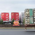 A truck hauling large broilers pulls into the Tyson Berry Street chicken processing plant in Springd...