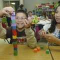 Izaac Haro, left, and Jasmine Gonzalez stack cubes during an exercise in creating shapes at Russell ...