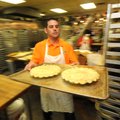 David Boone of Fayetteville makes apple pies Wednesday at Rick’s Bakery in Fayetteville. Bakers were...
