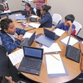 ESL LEARNING - Andrea McKenna teaches a small-group English as a second language class Nov. 16 at J....