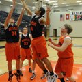 Rogers Heritage’s Jon Warner grabs a rebound in practice on Monday in Rogers.
