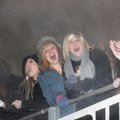 HEADING TO THE BIG GAME Fans cheer from under a powder-toss cloud Friday as the Bentonville Tigers t...