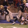 Pulaski Academy’s Greyson Skokos gets tripped by Ashdown’s Zack Erwin on Nov. 26 during their quarte...