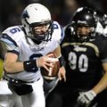 Springdale Har-Ber quarterback Ryan Luther is flushed out of the pocket by Bentonville defensive lin...