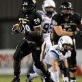 Bentonville running back Tearris Wallace breaks into the Wildcat secondary during the Tigers’ game F...