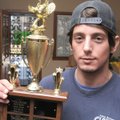 Nick Doss, president of the Gobble Wiffle Ball Classic, shows off the Gobble Cup on Saturday that te...