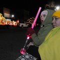 WAITING ON SANTA - Alexis Ward, 7, of Springdale sits with her mother, Julie Ward, on Saturday durin...
