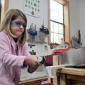 Clear Spring second-grader Alena Guillory makes a box during shop class Wednesday afternoon. The Eur...