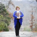 Merry Dye holds a scrapbook Wednesday of photos of her daughter, Mariah West, who was killed in a ca...