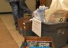Sabrina Chesne, faculty sponsor of the NorthWest Arkansas Community College’s English Honors Society, looks through book donations Wednesday at Burns Hall in Bentonville. The society is holding a book drive and will donate the new and used books to the Samaritan House in Rogers.