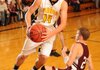 Prairie Grove guard Jalen Beeks drives past Huntsville’s Jake Kirk during the first half of play Tuesday at Prairie Grove.