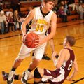 Prairie Grove guard Jalen Beeks drives past Huntsville’s Jake Kirk during the first half of play Tue...