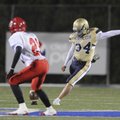 Shiloh Christian’s Seung Jae Lee kicks off against McGehee on Nov. 19 in the second round of the Cla...