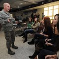 Master Sgt. Greg Qualls of the Arkansas Air National Guard’s 188th Fighter Wing shows hats Wednesday...