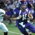 Fayetteville senior quarterback Brandon Allen, right, slips past Jonesboro senior defender Terrance ...
