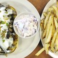 The Big John sandwich at The Front Porch Family Diner is made with strips of ribeye, onion, green pe...