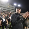 Bentonville’s head coach Barry Lunney Sr. applauds his team after the Tigers defeated Fayetteville 4...