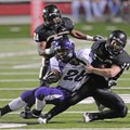 Fayetteville’s Brice Gahagans gets brought down by Bentonville’s Josh Herren, right, and Demarcus Mu...