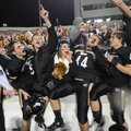 Bentonville players and fans celebrate the Tigers’ 49-28 win over Fayetteville on Friday during the ...