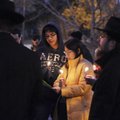 MENORAH LIGHTING Joshua Sadinsky and his mother, Li-Li, sing Hanukkah songs during a public menorah ...