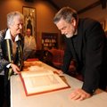 Jungian analyst Virginia Krauft, left, shows her copy of Carl Jung’s “Red Book” to the Rev. Lowell G...