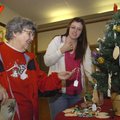 YULE SEASON CRAFTS Vernella Hennington, left, of Bella Vista looks at Christmas ornaments Friday mad...