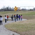 Fifth-graders at Tyson Elementary School make use of the walking trail during their recess Wednesday...
