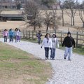 Tyson Elementary School fifth-graders walk along a trail Wednesday on the playground at the school i...