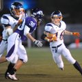  Heritage senior running back Zach Stewart (16) carries the ball as junior Chaz Miller (30) closes i...