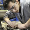  Fayetteville high school juniot Jeff Baker works on a transmission during Northwest Technical Insti...