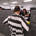 Jen James, a Washington County deputy, processes a prisoner Thursday at the Washington County Detent...