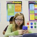 Brianna Henley, 11, works on a math problem Thursday in Krista Webb’s sixth grade math class at Elmw...