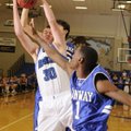 Rogers High senior Nathan Allred grabs a rebound in front of Conway senior Colt Fason, rear, and sen...