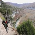Hikers tread carefully on the Goat Trail high above the Buffalo National River.