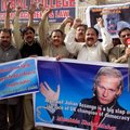 Pakistani protesters rally to condemn the arrest in London of WikiLeaks founder Julian Assange, seen...