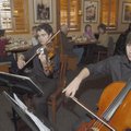 CUISINE AND A QUARTET - Bentonville High School orchestra students Kolby Williams, left, and Ronald ...