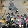 Members of the Patriot Guard lead a funeral procession Thursday ahead of a hearse carrying the body ...