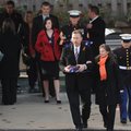 Terry and Tami Boyett of Bentonville, stepfather and mother of Cpl. Chad Stafford Wade, are escorted...